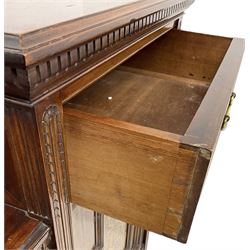 Late Victorian mahogany drop-centre sideboard, moulded and dentil top with raised cast metal galleries, fitted with two drawers and two panelled cupboards, central display cabinet enclosed by two astragal and bevel glass glazed doors, inlaid with curled acanthus leaves and fruit cornucopias, moulded uprights terminating to square tapering spade feet, united by undertier 