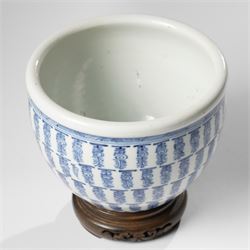 Chinese fish bowl, painted profusely with repeating symbols in blue, on hardwood stand, unmarked, including stand H16cm