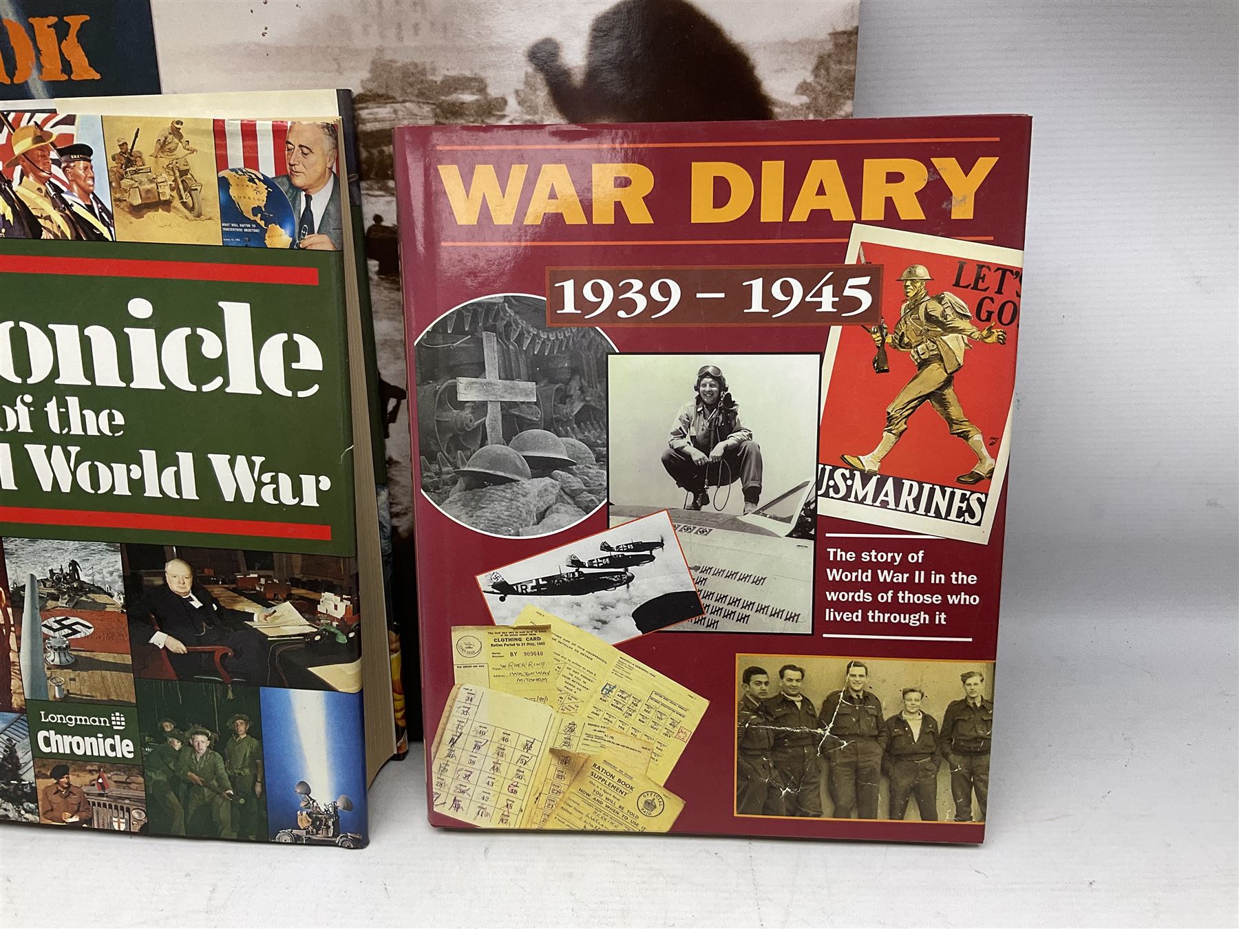 Thirty modern books of military interest including The Wartime Scrapbook 1939-1945; D-Day by Stephen Badsey; The D-Day Experience by Richard Holmes; Desert Rats by John Parker; A Most Secret Squadron by Des Curtis; Flying Colours - The Epic Story of Douglas Bader by Laddie Lucas etc; and quantity of DVDs of war and military interest