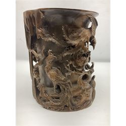 20th century Chinese brush pot, lof cylindrical form with deep relief carving of birds within peony bushed, H25cm