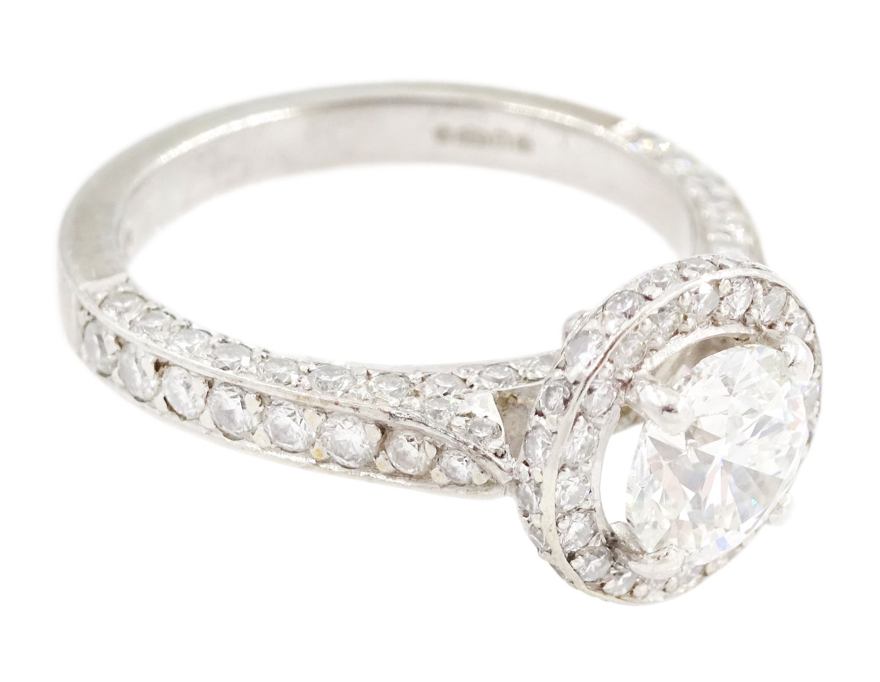 Platinum round brilliant cut diamond cluster ring, the principal diamond of approx 1.05 carat, with diamond surround and shoulders, London 2009, total diamond weight approx 1.65 carat