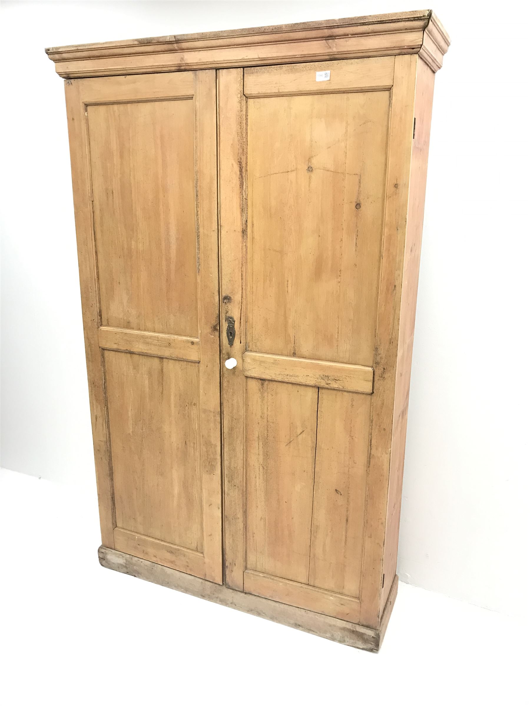 19th century housekeeping cupboard, projecting cornice above two panelled doors, plinth base