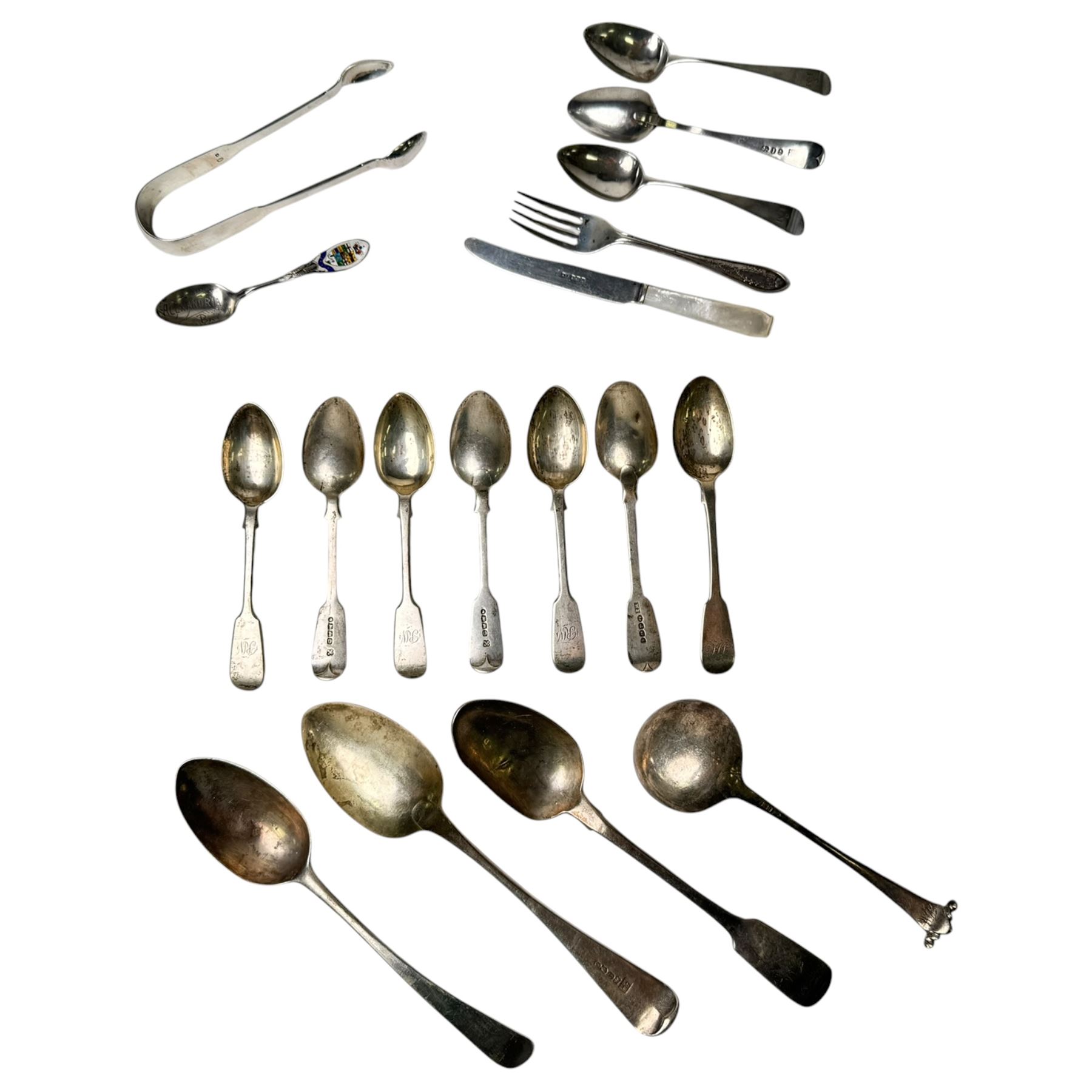 Collection of silver cutlery, including teaspoons, tablespoons, mother of pearl handled butter knife, fork and sugar tongs, all stamped or hallmarked