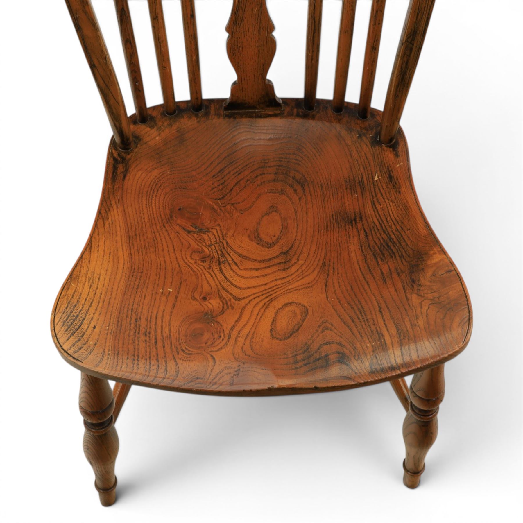 Set of six elm Windsor chairs, saddle seats with crinoline stretchers