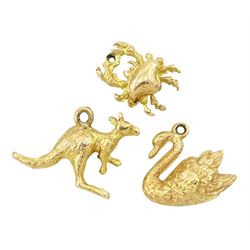 Three 9ct gold pendant / charms including kangaroo, crab and swan