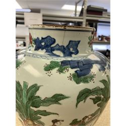 17th century Transitional period Chinese Wucai vase and cover, of baluster form, the body painted with ladies upon a terrace, and figures upon horseback and attendants within a fenced garden, the domed cover with knop finial painted with boys at play, H37cm
