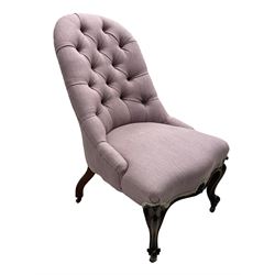 Victorian rosewood framed nursing chair, buttoned back and sprung serpentine fronted seat upholstered in mauve fabric, fan and scroll carved apron over cabriole supports and castors