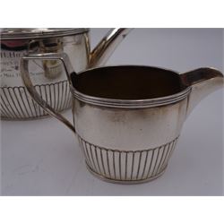 1930s American silver three piece batchelors tea service, comprising teapot, twin handled open sucrier and milk jug, each of part fluted oval form, the teapot with personal engraving to body, wood effect handle and silver urn shaped finial, stamped sterling with maker's mark for Gorham, teapot H13cm