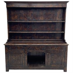 Bylaws of Leominster - 18th century design figured oak dog kennel dresser, the raised plate rack with projecting cornice over hooks and three tiers, moulded rectangular top over three drawers and two panelled cupboards, moulded frame and panelled sides, on stile supports