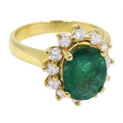 Gold oval emerald and diamond cluster ring, stamped 18K, emerald approx 1.60 carat