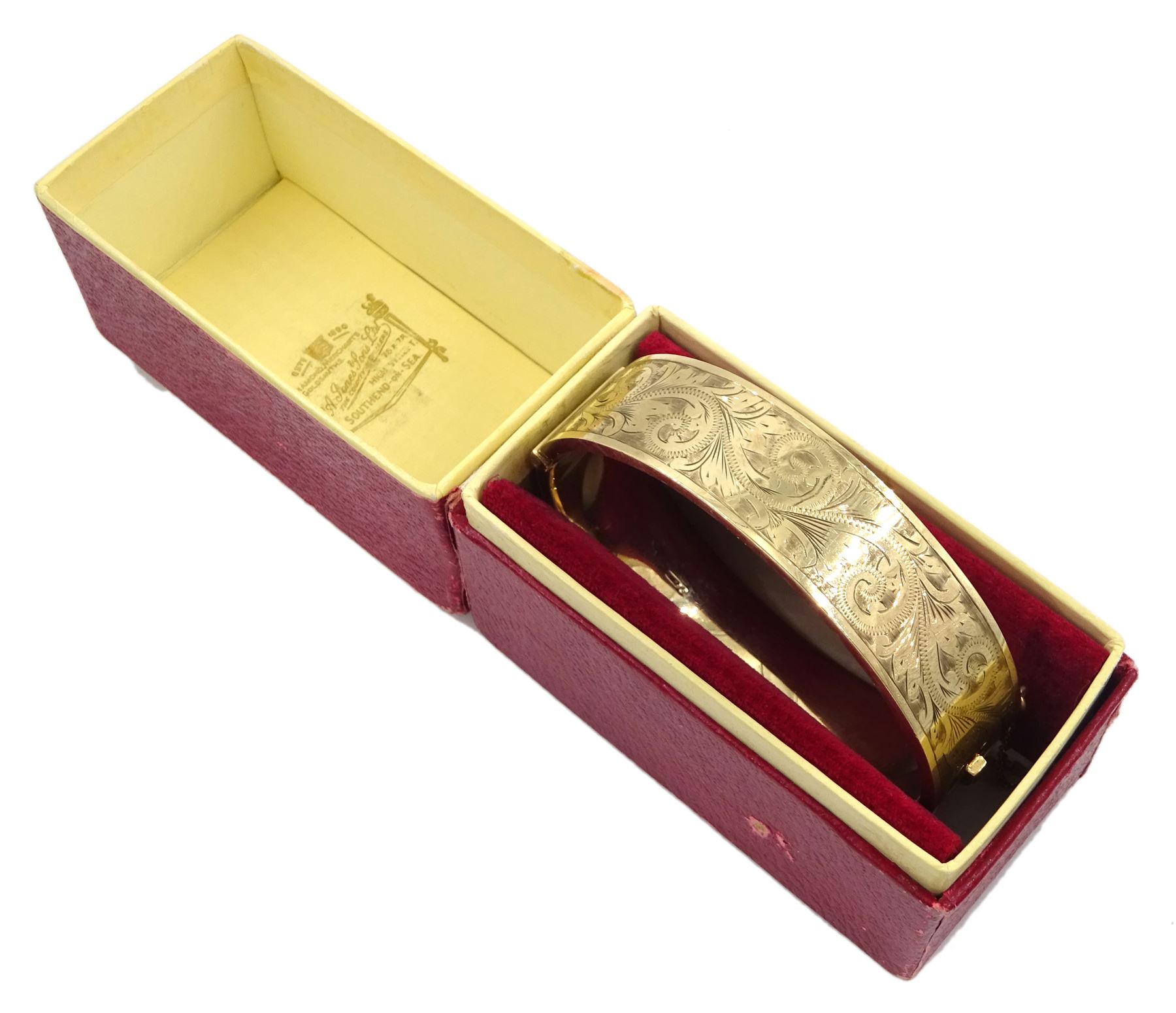 9ct gold hinged bangle with bright cut decoration by Henry Griffith & Sons Ltd, Birmingham