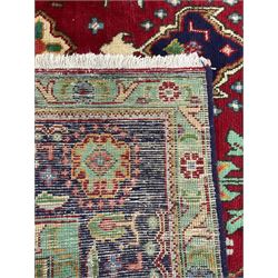 Qashqai red and blue ground rug, with central medallion, green repeating border with geometric motifs 
