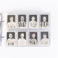Collection of Edwardian and later Football related trading and cigarette cards, including forty-nine of fifty 1906 Ogden's Football Club Colours, 1922 PALS Footall series, ninety of one hundred 1925 Gallaher Famous Footballers, complete set of forty-four 1926 Ogden's Captains of Association Football Clubs and Colours, complete set of fifty 1927 Players Football Caricatures by MAC,  complete set of fifty 1927 Players Football Caricatures by RIP,  complete set of fifty 1930 Players Association Cup Winners, complete set of 50 1933 Ogdens AFC Nicknames etc, housed in brown cigarette card album