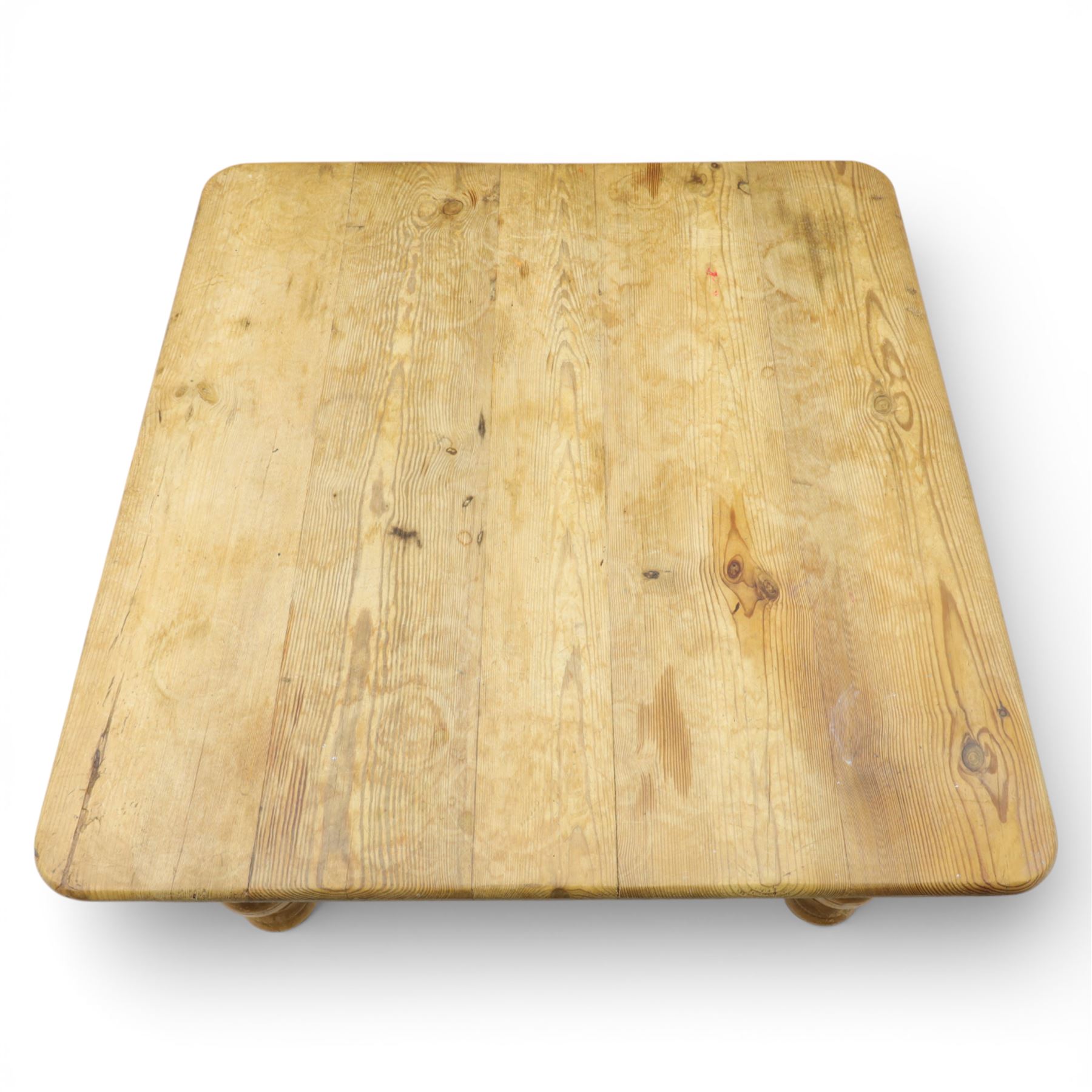 20th century stripped pine coffee table, square top over two frieze drawers, raised on block and turned supports