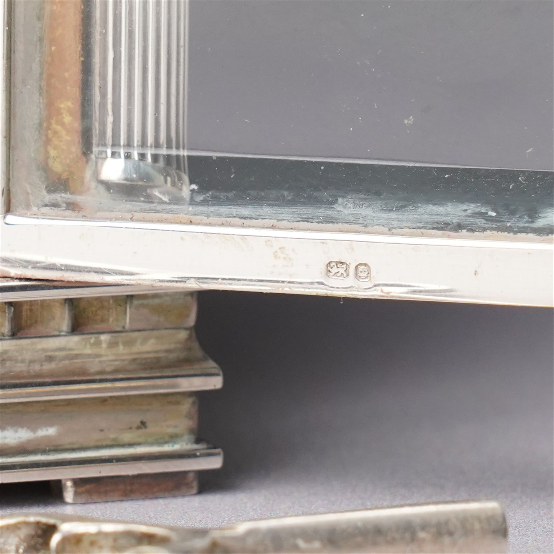 Chas Frodsham -  Miniature carriage clock with platform lever escapement commemorating the marriage of Prince Charles and Lady Diana Spencer, the white dial with an engine turned gilt surround and fleur de lis in silver case with fluted columns and bevelled glass panels H10cm  No.43/1000 London 1981 with key