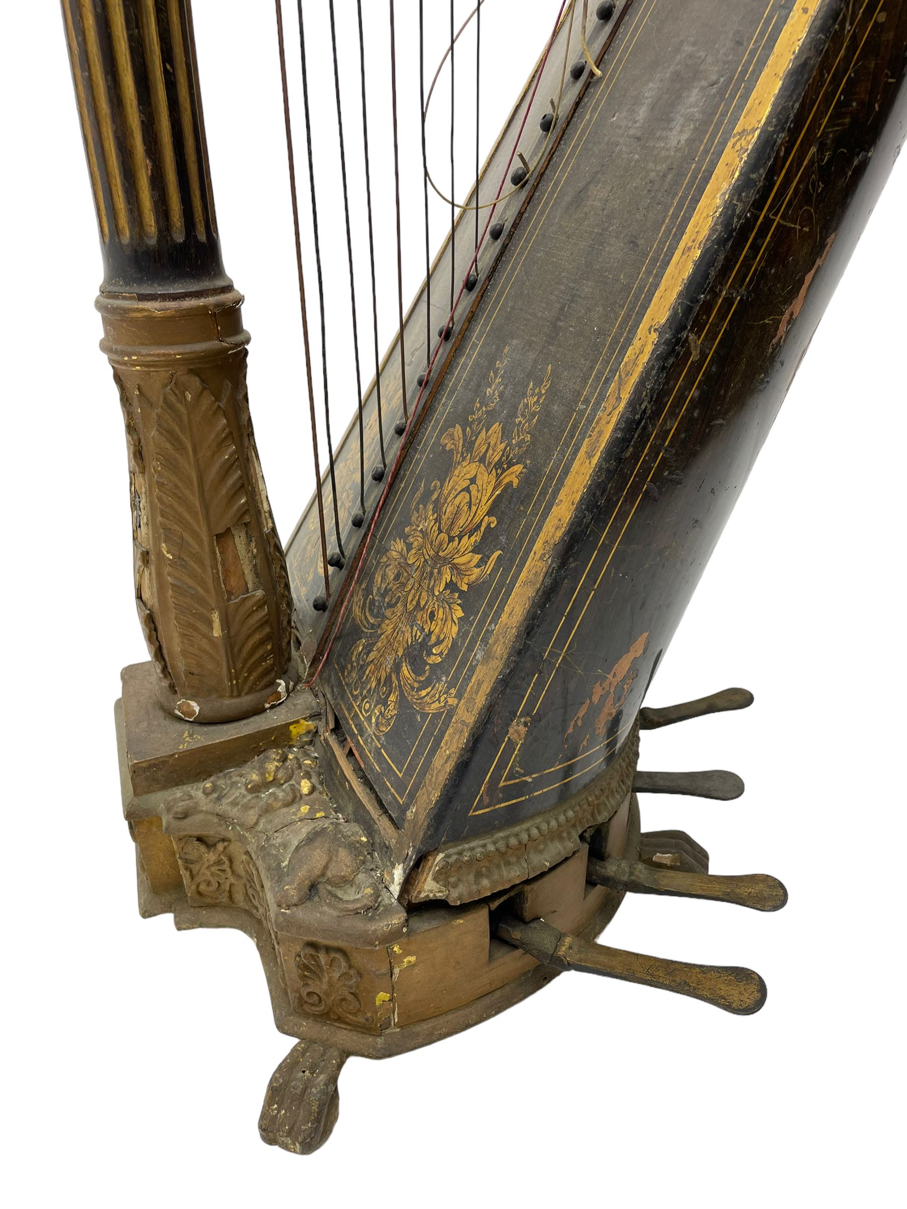 J. Erat. Wardour Street, London, Soho - Regency parcel-gilt and rosewood finish pedal harp, forty-three strings and five swell doors, the fluted pillar decorated with rams head capital, floral festoons, anthemion motifs and sarcophagi, the base decorated with pharaonic motifs and fitted with eight brass pedals, on carved paw feet, brass signature plate to top inscribed 'J. Erat. Wardour Street, London, Soho, 606'