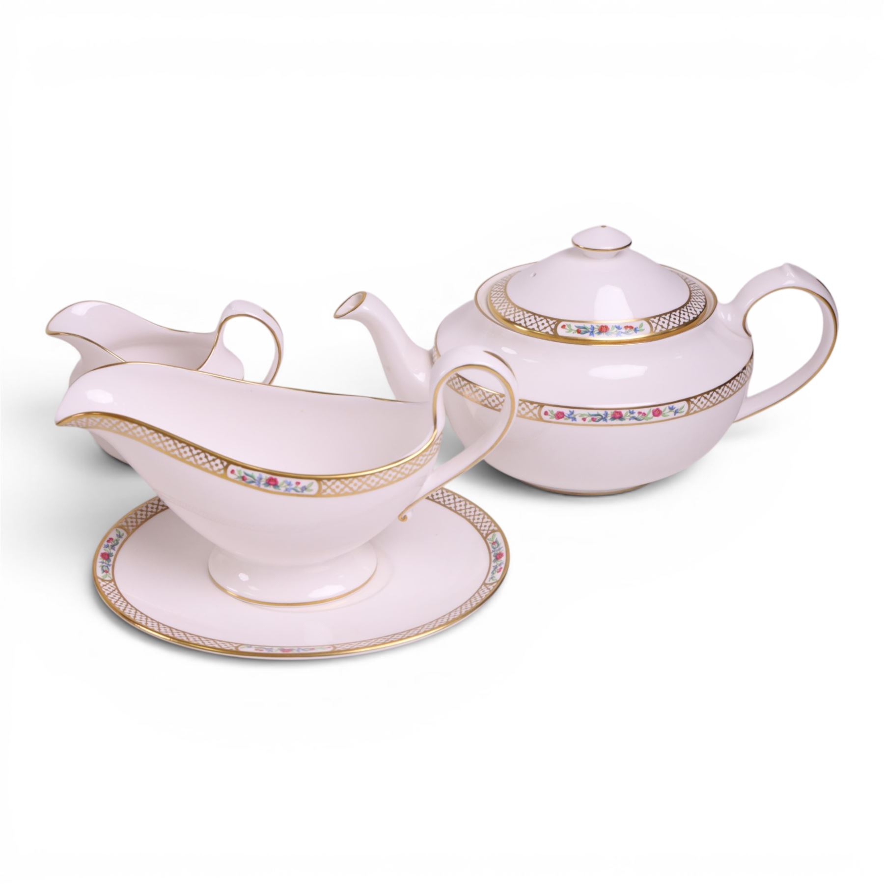 Spode Golden Trellis tea and dinner service for eight, including teapot, milk jug, open sucrier, teacups and saucers, dinner plates, soup bowls, side plates etc 