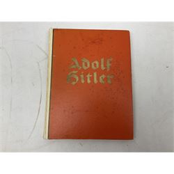 Adolf Hitler, Bilder aus dem Leben des Fuhrers [Pictures from the Life of the Fuhrer], Herausgegeben vom Cigaretten / Bilderdienst, Hamburg / Bahrenfeld, 1936, an album of two hundred tipped-in cards bearing photographs by Heinrich Hoffman, originally collected with cigarettes, 31 cm x 24 cm; together with a Waffen-SS book 'Wenn alle Bruder schweigen'; Hamburg 1939-1945; and two other booklets
