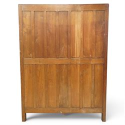 Mouseman - early-to-mid-20th century figured panelled and adzed double wardrobe of large proportions, the arcade carved cresting rail over two doors with adzed and figured oak panels, with wrought metal hinges and latch, relief carved mouse signature, the interior fitted with hanging rail, by the workshop of Robert Thompson, Kilburn