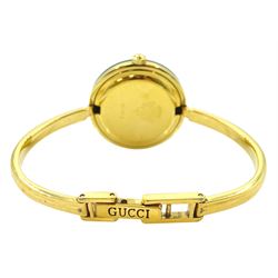 Gucci ladies gold-plated quartz wristwatch, Ref. 11/12.2, with eleven interchangeable coloured ring bezels, boxed with warranty card dated 1997 