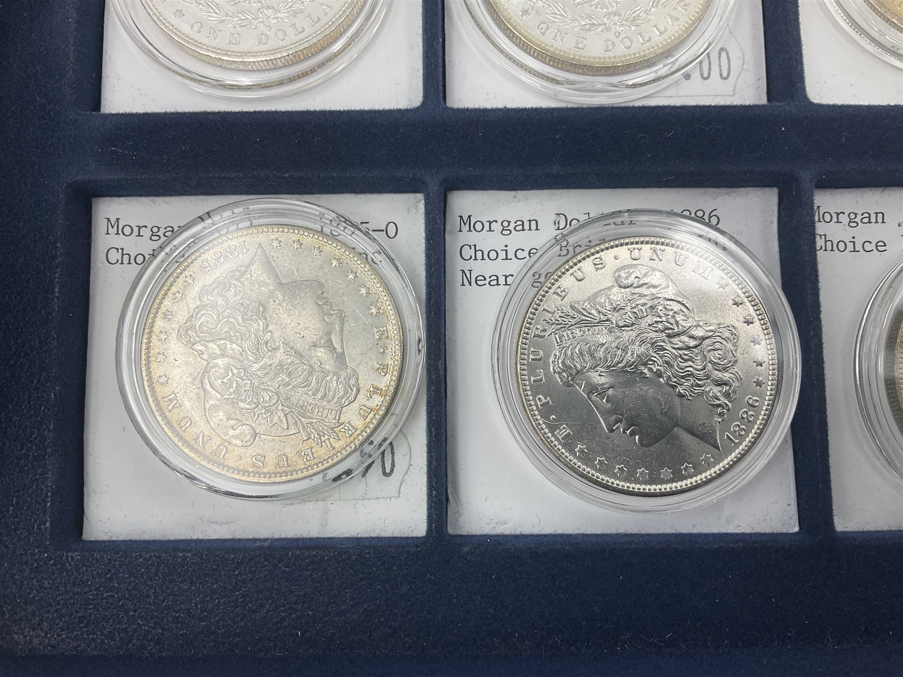 Twelve United States of America silver Morgan dollar coins, dated 1878 S, 1879 S, 1880 S, 1881 S, 1882 O, 1883 O, 1884 O, 1884 CC, 1885 O, 1886, 1887 and 1888