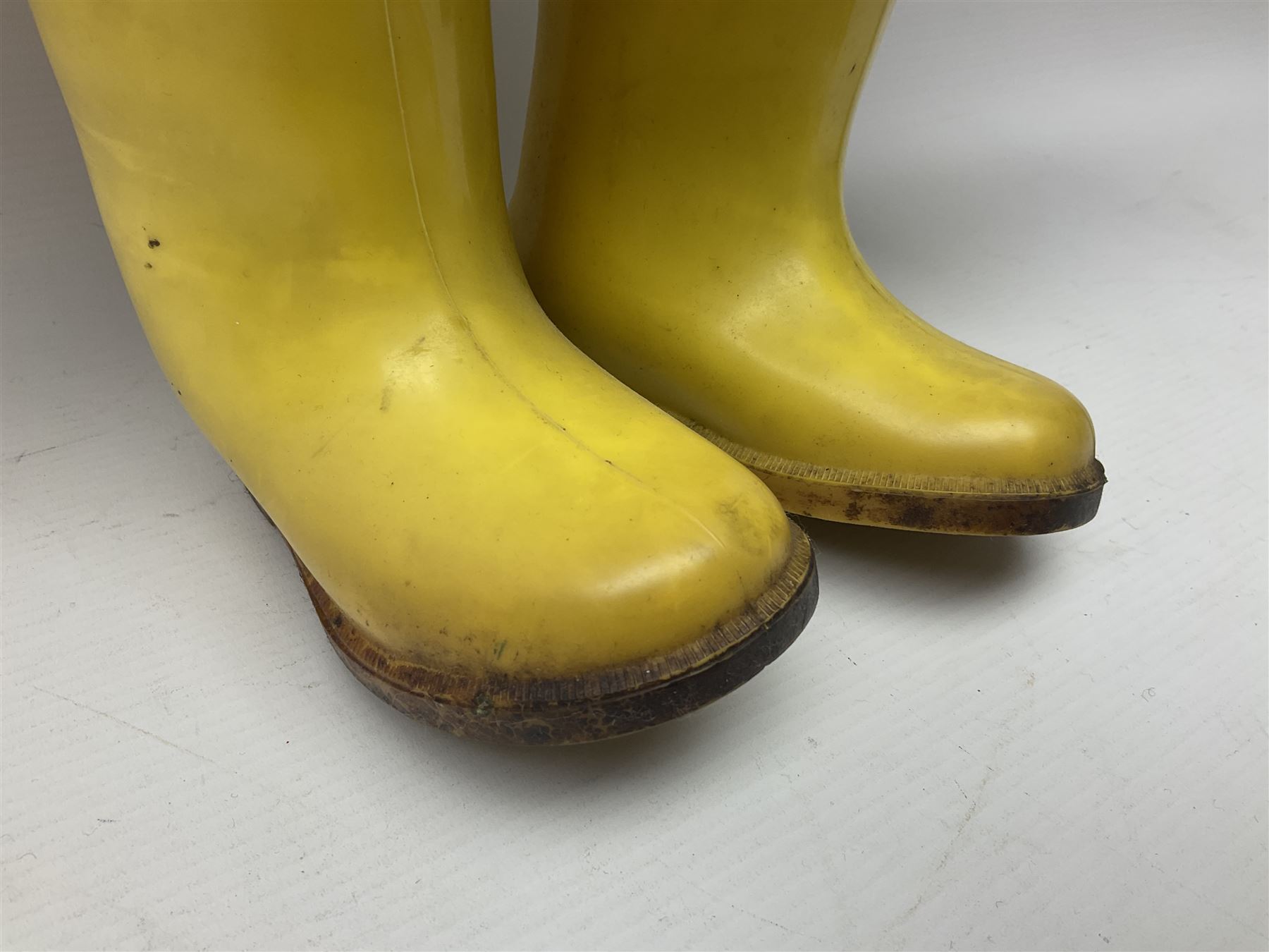 Vintage Paddington Bear teddy with yellow felt hat, green coat and yellow Dunlop boots, H48cm