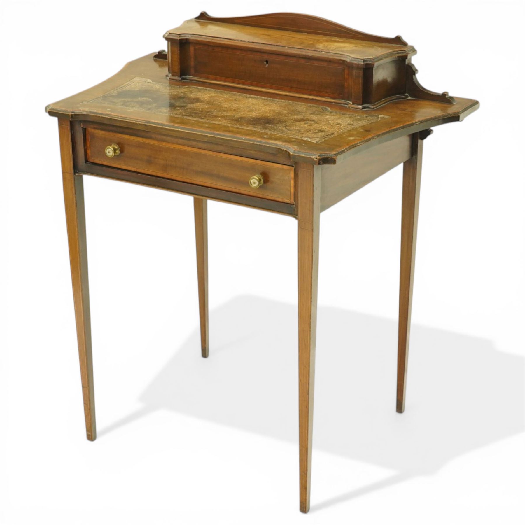 Edwardian inlaid mahogany ladies writing desk, shaped top surmounted with lidded stationary compartment, above a singular drawer, on slender tapering supports