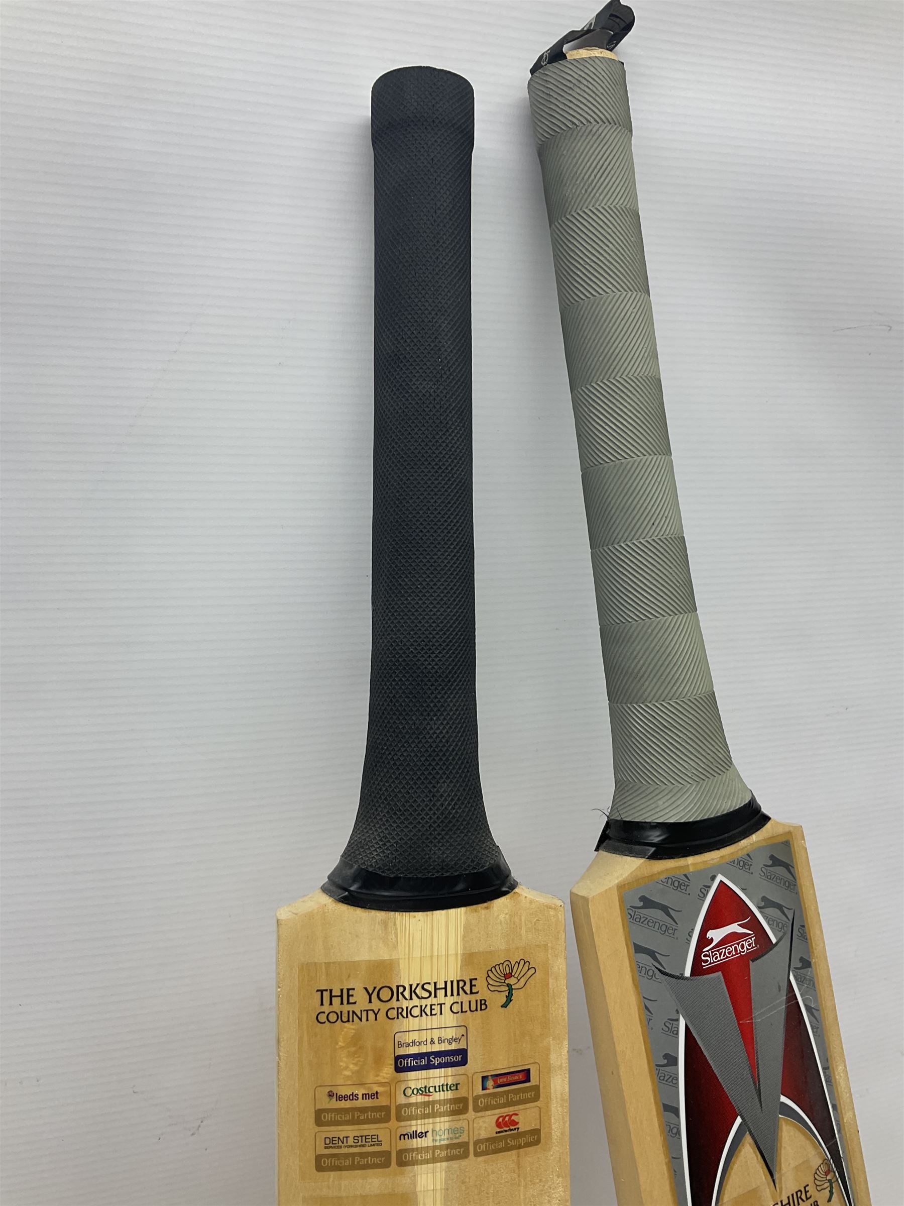 Two signed Yorkshire County cricket bats, from 2007 and 2008 seasons, bearing signatures including Darren Gough, Jason Gillespie, Younus Khan, Michael Vaughn and Tim Bresnan, etc