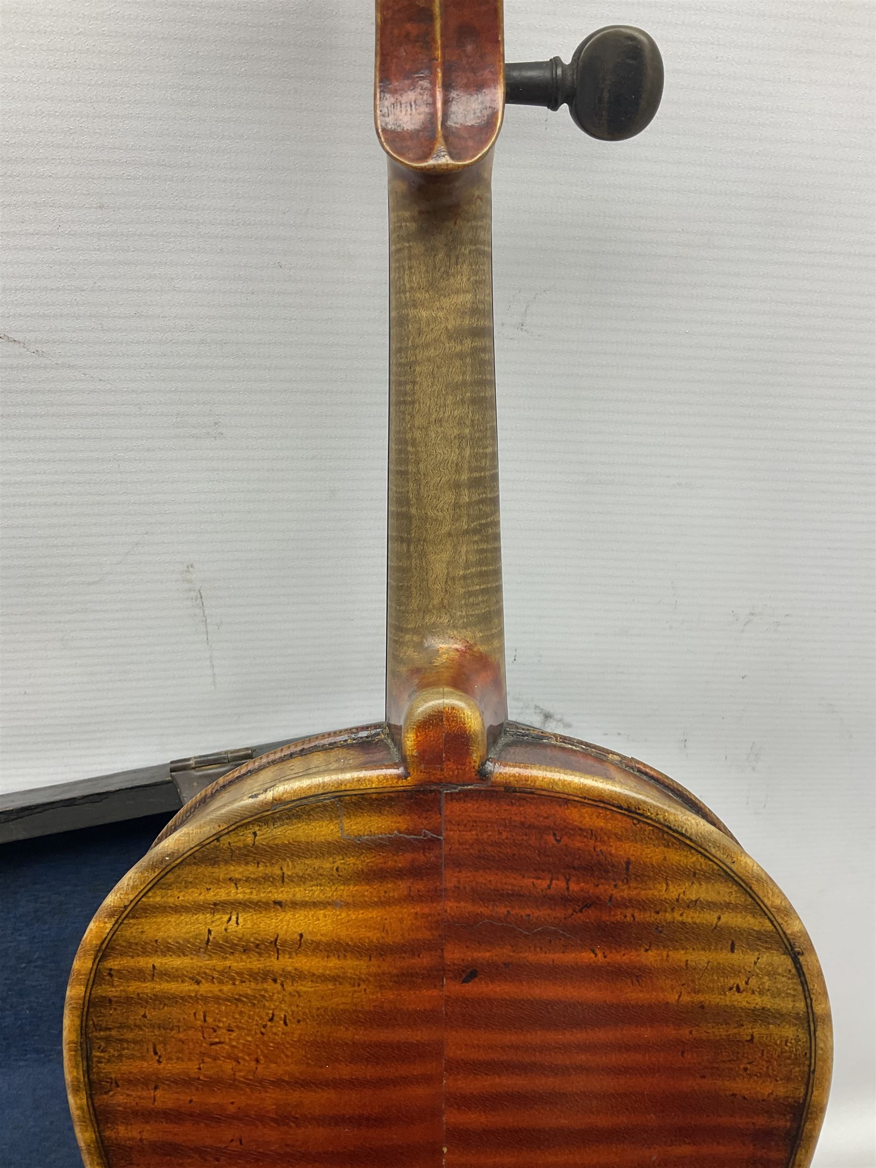 Late 19th century French three-quarter size 'Conservatory' violin with 34cm two-piece maple back and ribs and spruce top, the peg box inscribed 'Conservatory Violin Straduari', bears label 'Antonius Stradiuarius Cremonensis Faciebat Anno 1721' L55.5cm overall; in ebonised wooden 'coffin' case