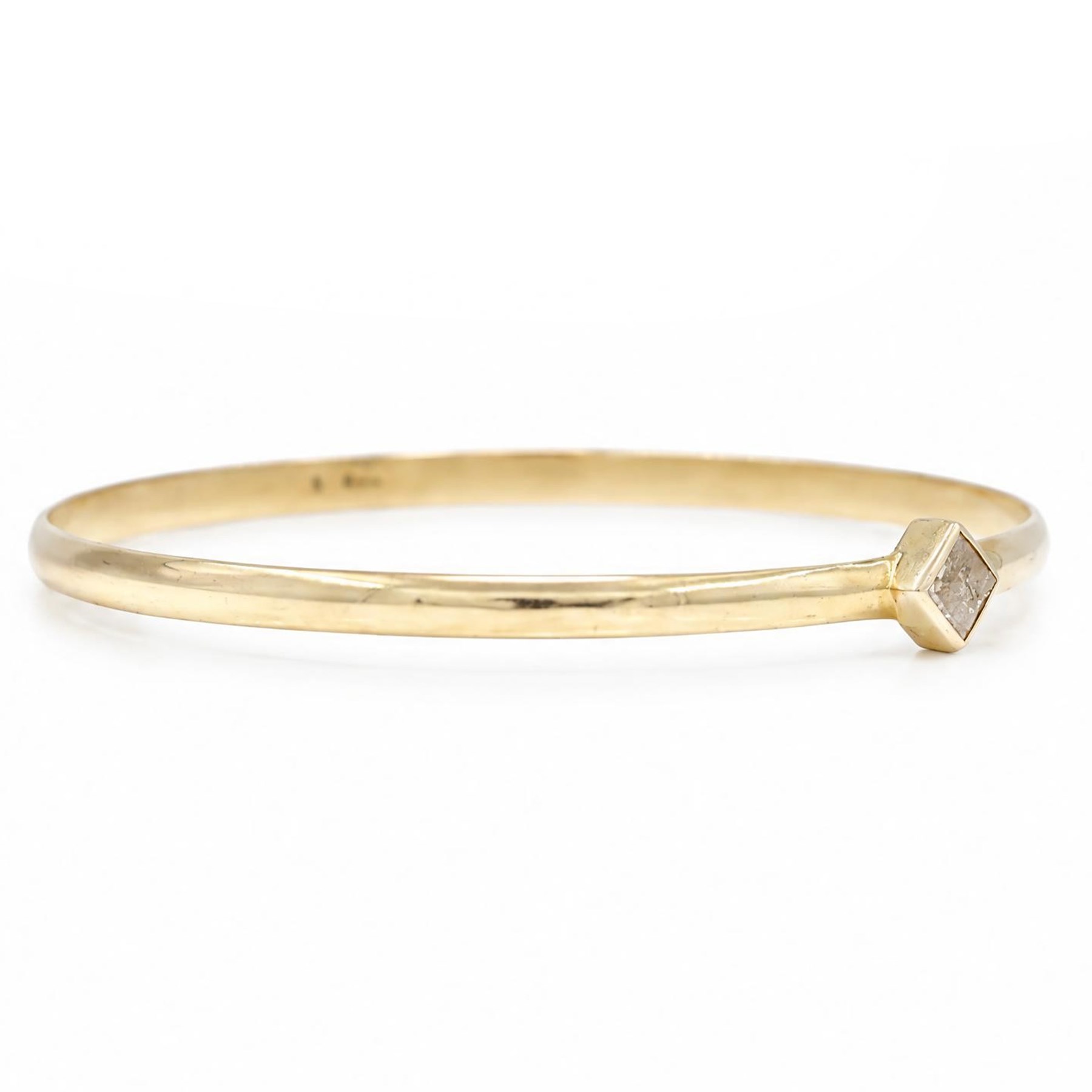 18ct gold fancy champagne / brown diamond bangle, bezel set with a single princess cut diamond of approx 0.70 carat, stamped 750