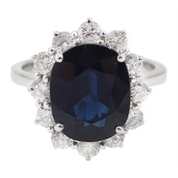 18ct white gold oval sapphire and diamond cluster ring, hallmarked, sapphire approx 4.30 carat, total diamond weight approx 1.05 carat