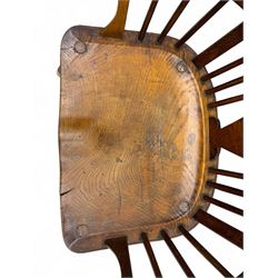 Early-to-mid 19th century elm and ash high-back Windsor armchair, central vase-shaped splat flanked by slender vertical spindles, outward-curving arms, shaped and dished saddle seat, raised on turned and splayed supports united by H-stretcher