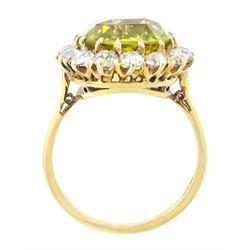 Early 20th century gold chrysoberyl and diamond cluster ring, single cushion cut yellow / green chrysoberyl of approx 8.00 carat, surrounded by sixteen old cut diamonds, stamped 18ct, total diamond weight approx 1.10 carat