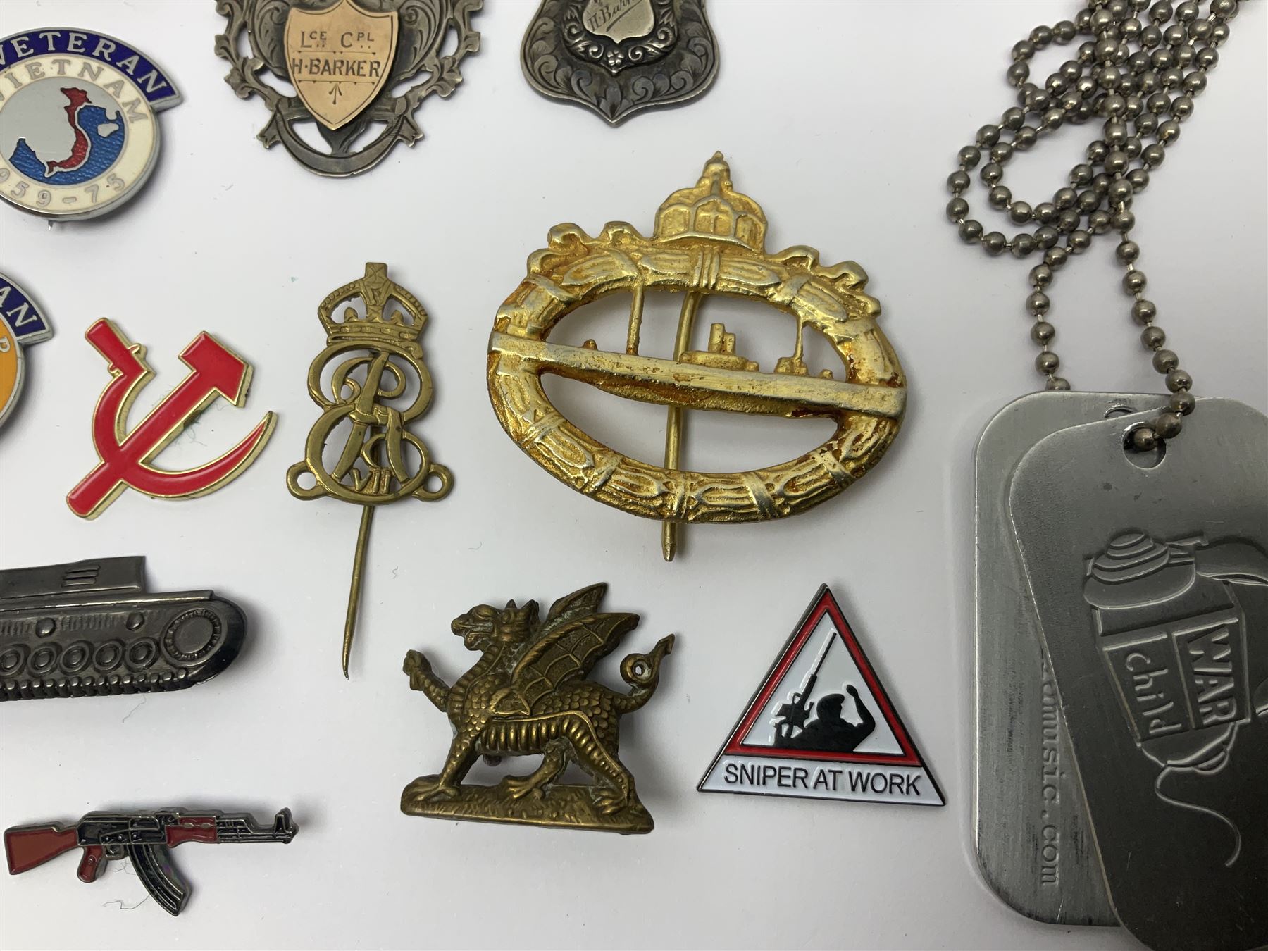 Two Edwardian hallmarked silver presentation fobs for military bugling competitions; and quantity of cap/glengarry and other badges, sweetheart brooches etc