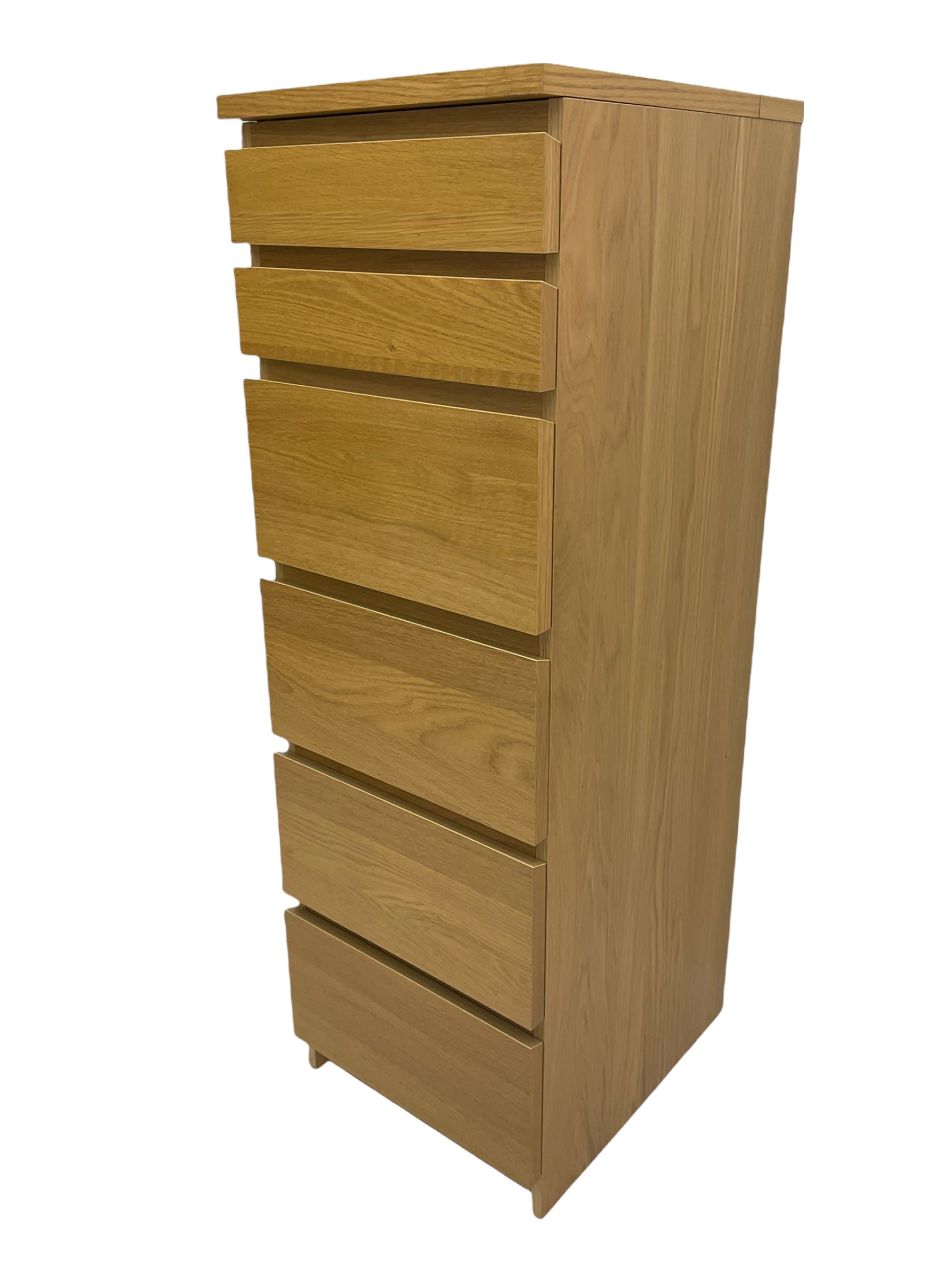 IKEA light oak finish chest, fitted with hinged vanity top, above six graduating drawers 