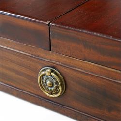 Early 19th century and later mahogany washstand, the dual-hinged fold-out top, over a cupboard enclosed by tambour roll, fitted with deep drawer to base disguised as two cock-beaded drawers, on splayed supports