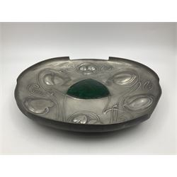 Liberty & Co Tudric pewter Bollelin tray, designed by Archibald Knox, of circular form with shaped edge, cast in relief with foliate tendrils surrounding a green enamel cartouche, impressed beneath Made by Library & Co English Pewter 044, D25.5cm