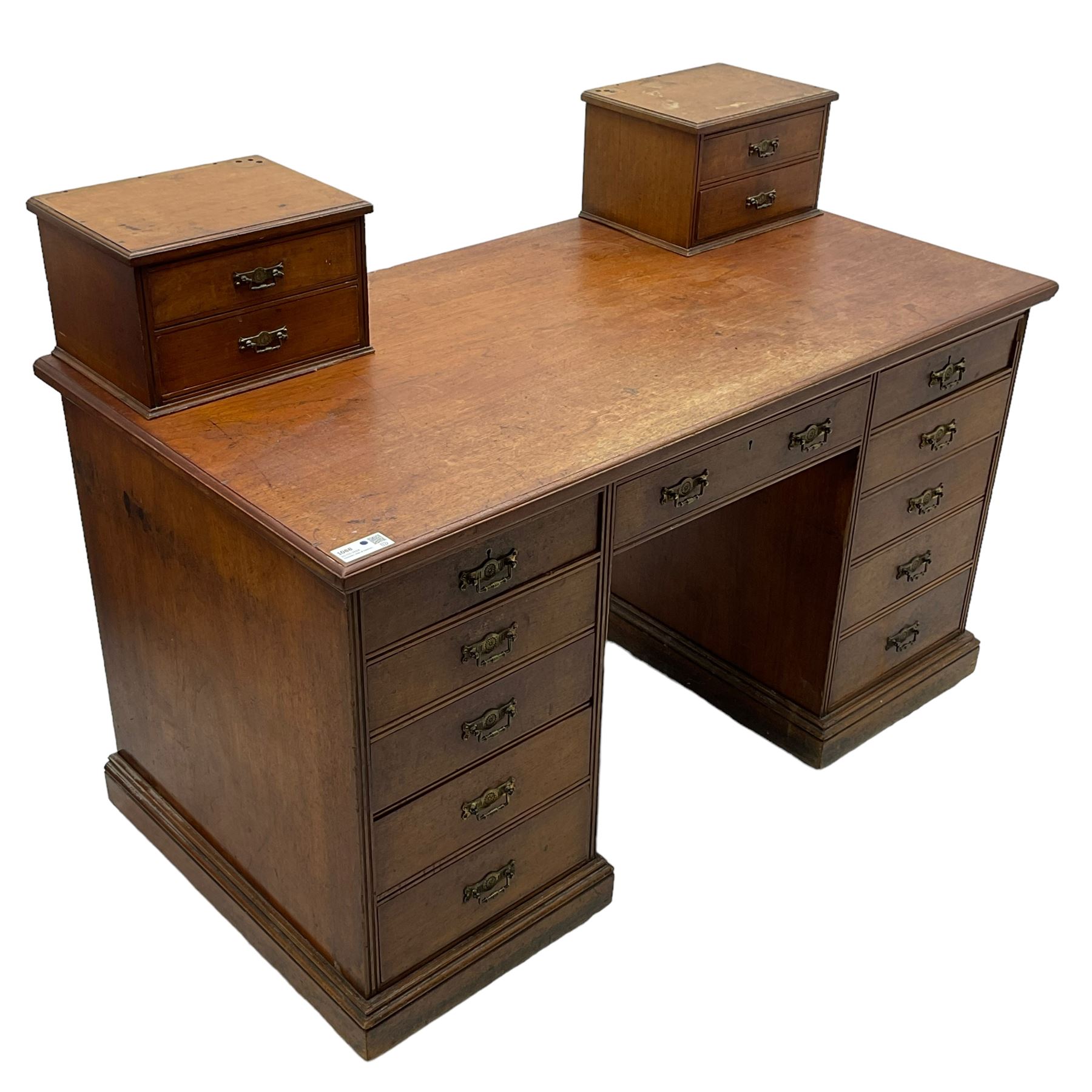 C. Hindley & Sons (London: 1820-1892) - Late Victorian walnut twin pedestal desk, the rectangular moulded top surmounted by two banks of two drawers over eleven graduating drawers, on moulded plinth base, the central drawer stamped 'C. Hindley & Sons, 134 Oxford Street, London, 5298'