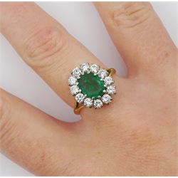 18ct gold oval emerald and round brilliant cut diamond cluster ring, Birmingham 1987, emerald approx 1.00 carat, total diamond weight approx 0.70 carat