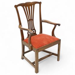 George III mahogany open elbow chair, shaped cresting rail over pierced splat, shaped arms with scroll carved terminals, drop-in seat upholstered in red fabric, on square supports with moulded edge united by plain stretchers 