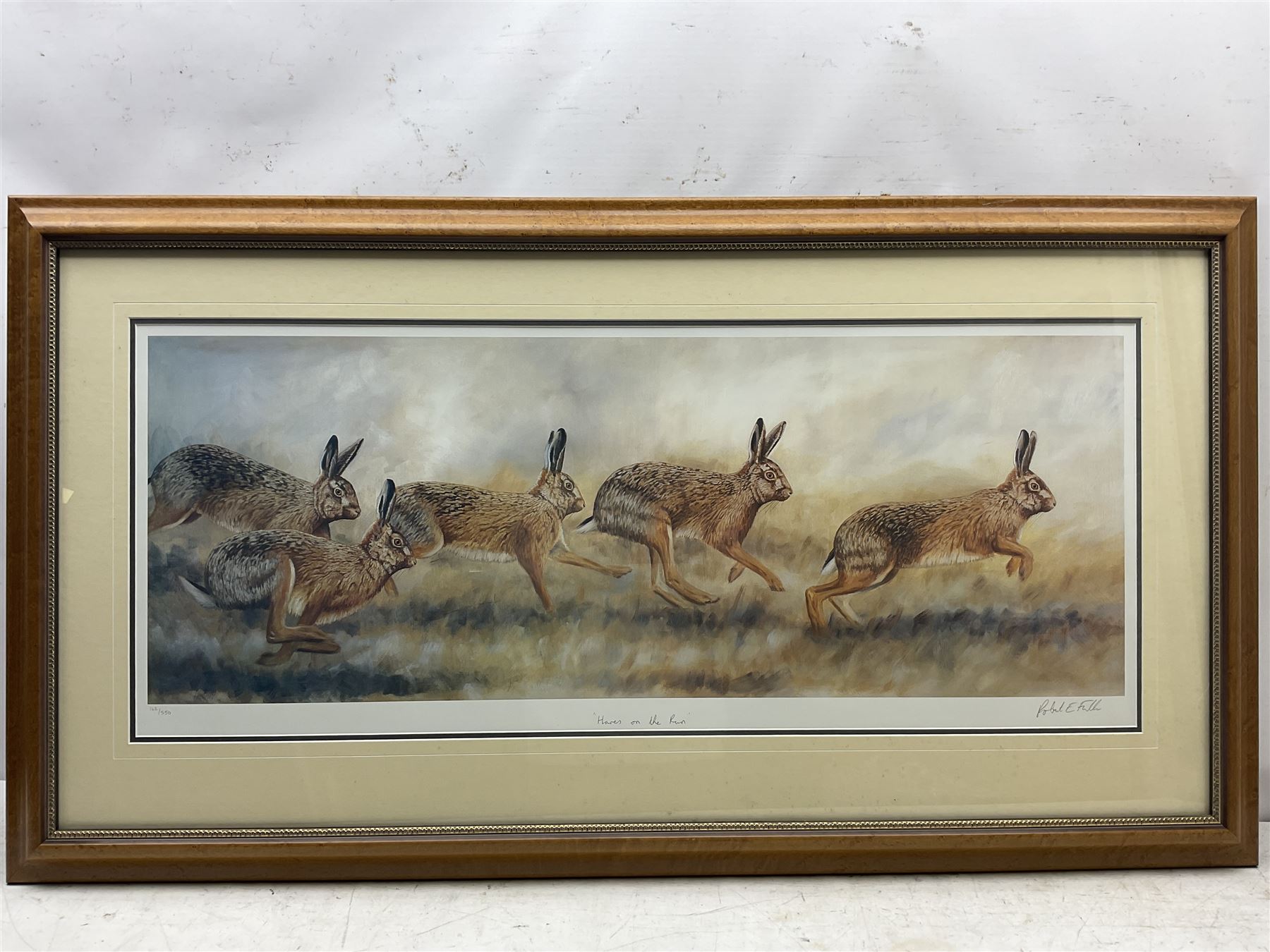 Robert E Fuller (British 1972-): 'Hares on the Run', large limited edition colour print signed titled and numbered 162/850 39cm x 95cm