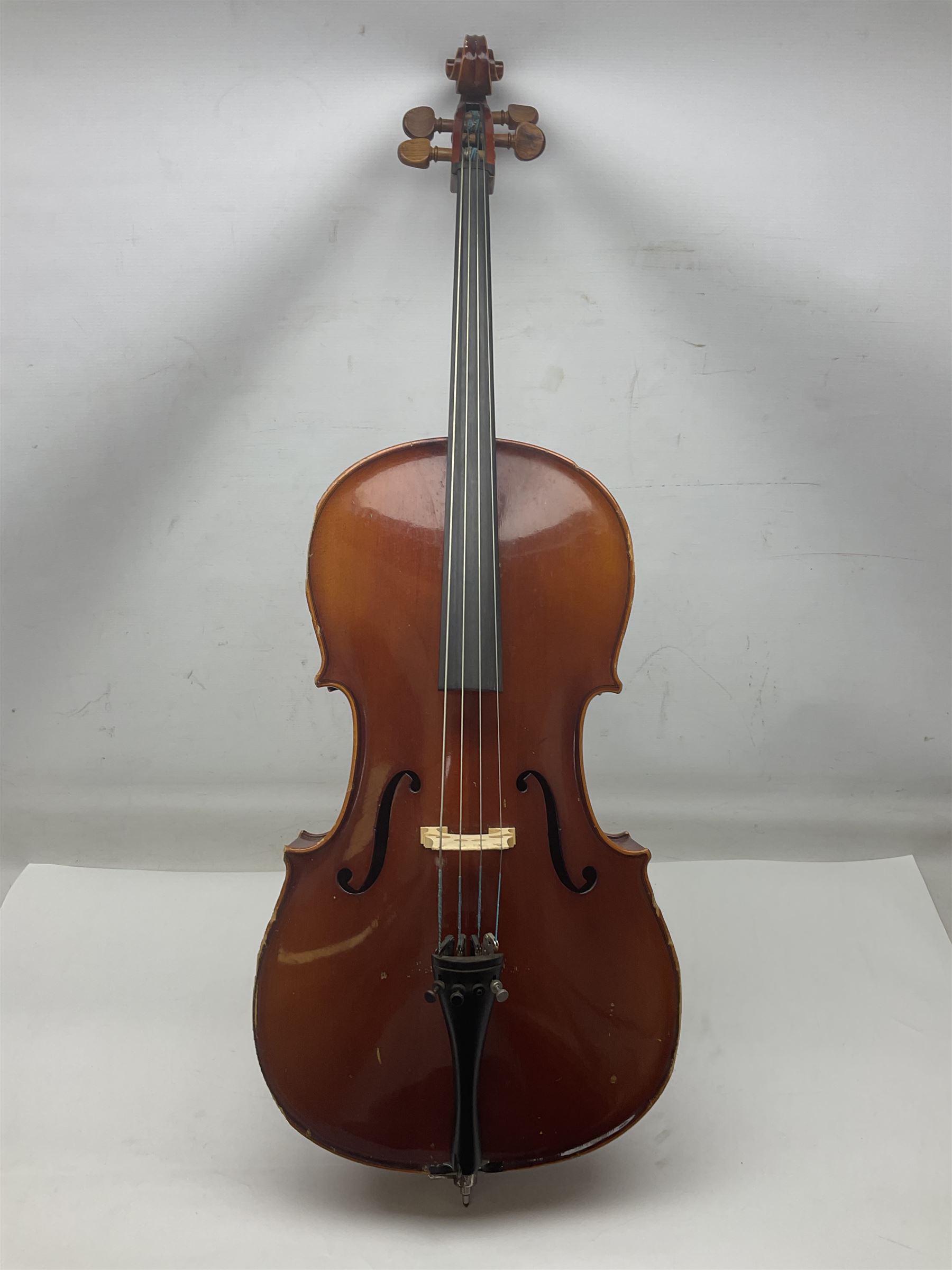 Two student half-size cellos - Boosey & Hawkes Artia with 65cm one-piece back and spruce top; bears maker's label; L104cm overall; and Romanian with 65.5cm two-piece maple back and ribs and spruce top; bears label; L108.5cm overall; each in soft carrying case with two bows (2)