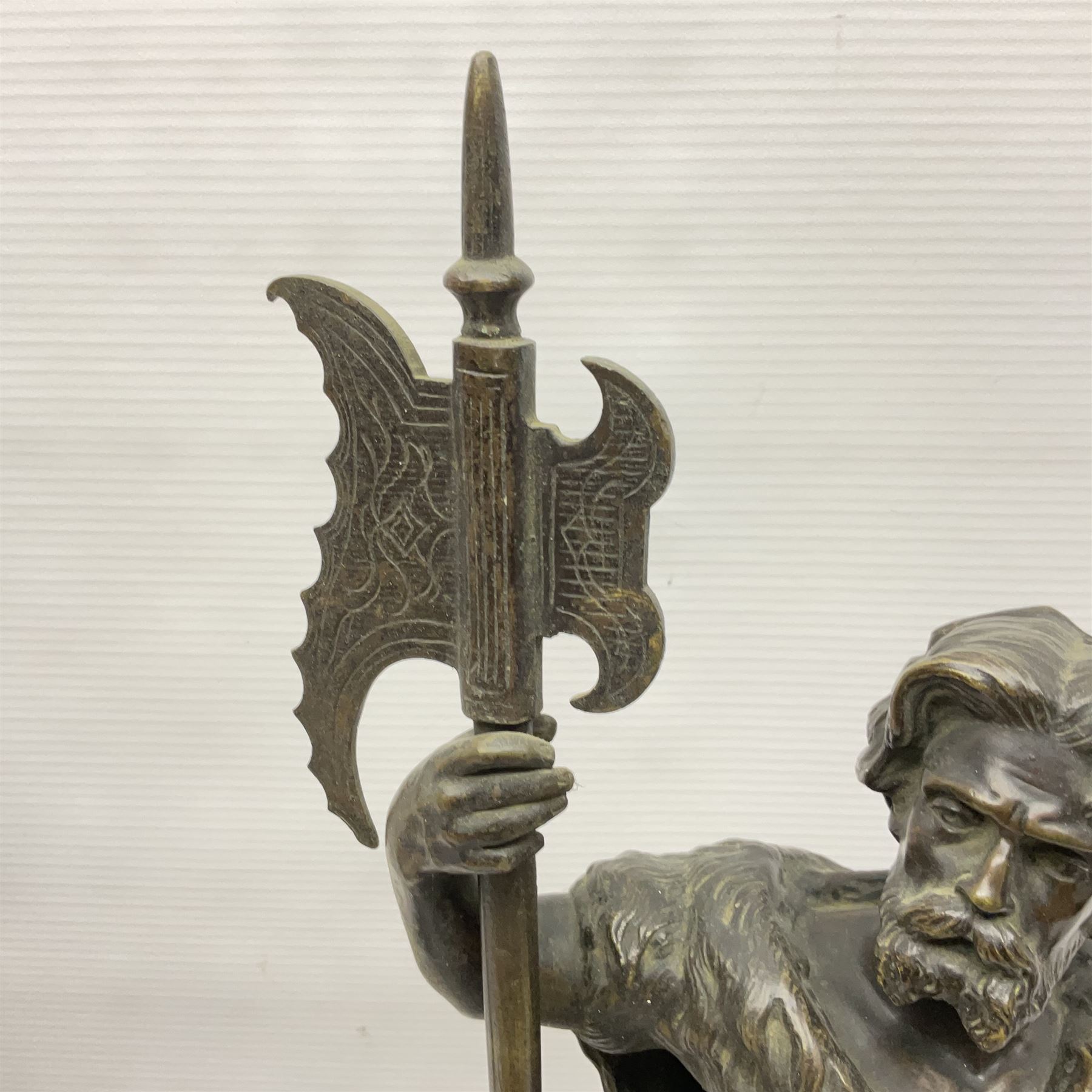 Pair of bronzed figure modelled as a hunter in traditional dress, each holding a pike, H48cm