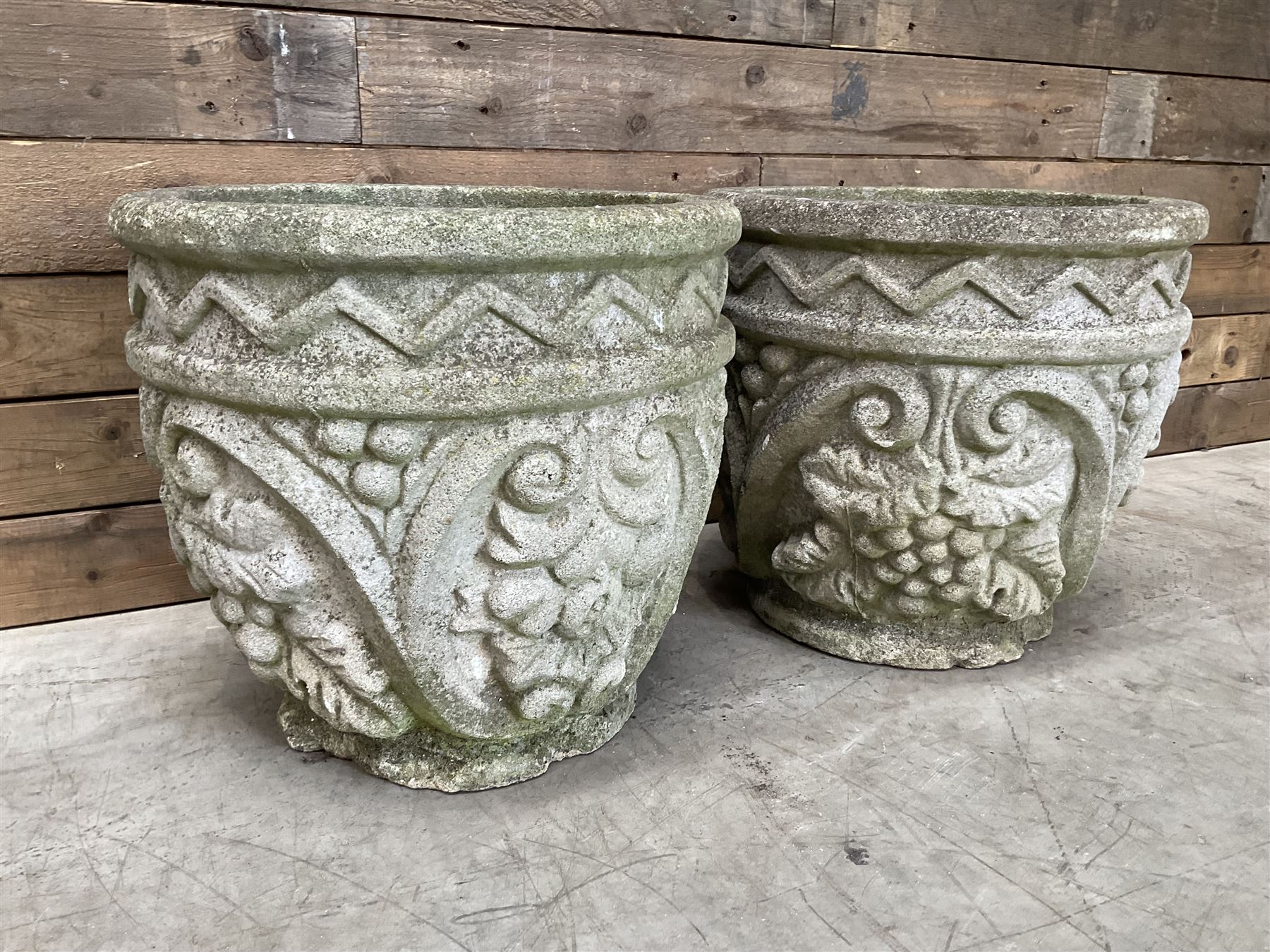 Pair of cast stone ornate circular planters
