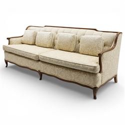 Mahogany framed three seat sofa in the Louis XV style, the shaped buttoned back above loose seat cushions and scrolling arms, raised on cabriole legs with shaped apron