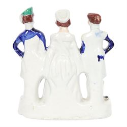 Rare mid 19th century Staffordshire figure group, Napoleon III, Victoria and Abdul-Medjid, made to commemorate the alliance of the three nations in the Crimean War, Victoria stands central with Napoleon in military uniform to her right, and the Sultan to her left, upon a titled base, H23.5cm