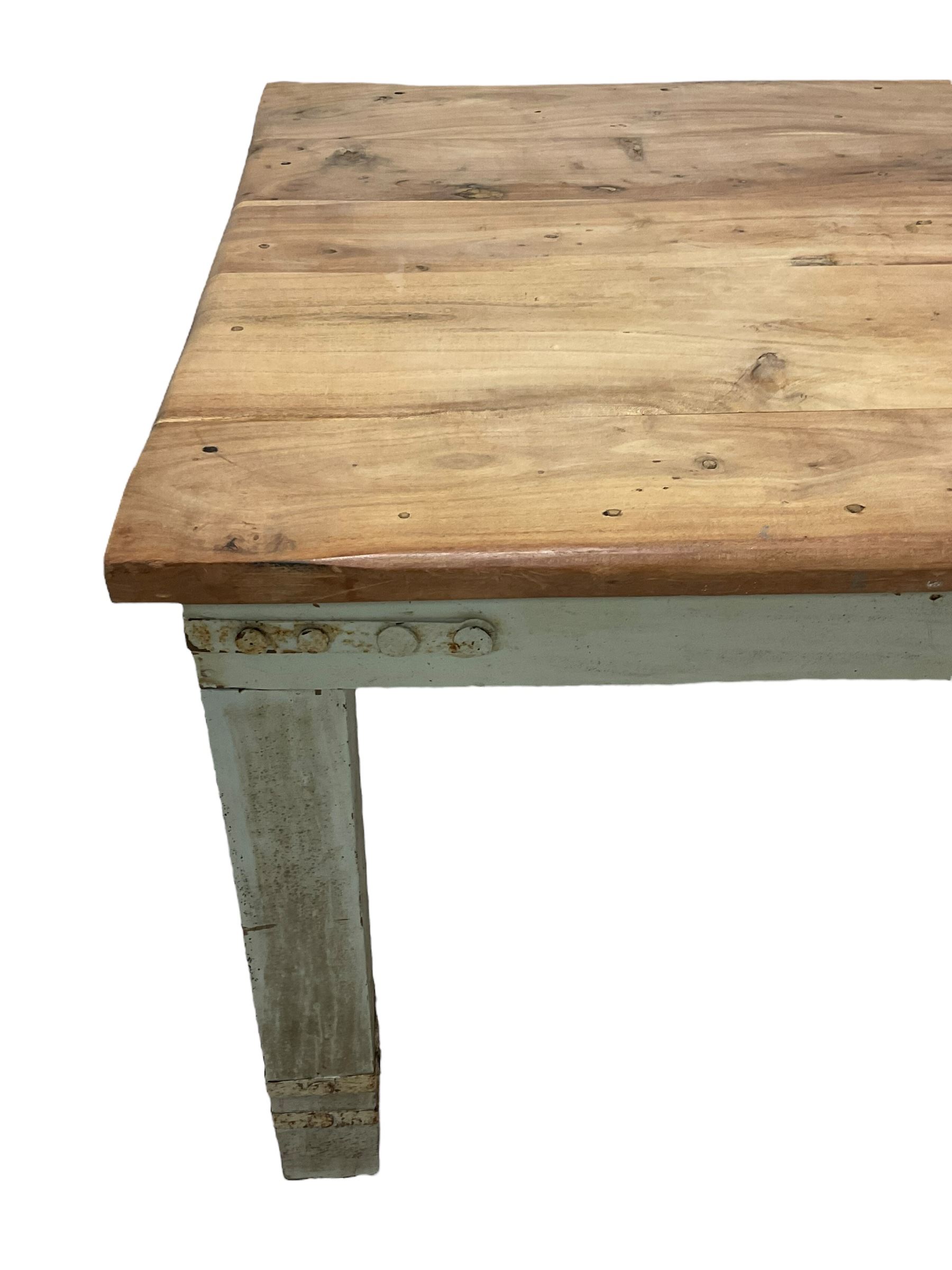 Painted hardwood farmhouse kitchen dining table, rectangular top on painted base, on square supports, bound with metal strappings 