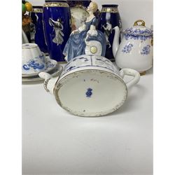  Mintons teapot of oval form, circa 1900, decorated in blue with foliate sprigging within gilt borders upon white ground, Shelley Heavenly Blue teapot, together with another Shelley teapot decorated with berries and foliage, two Royal Doulton figures comprising Biddy Penny Farthing HN1843 and Hilary HN2335, pair of Spode's New Stone plates, etc