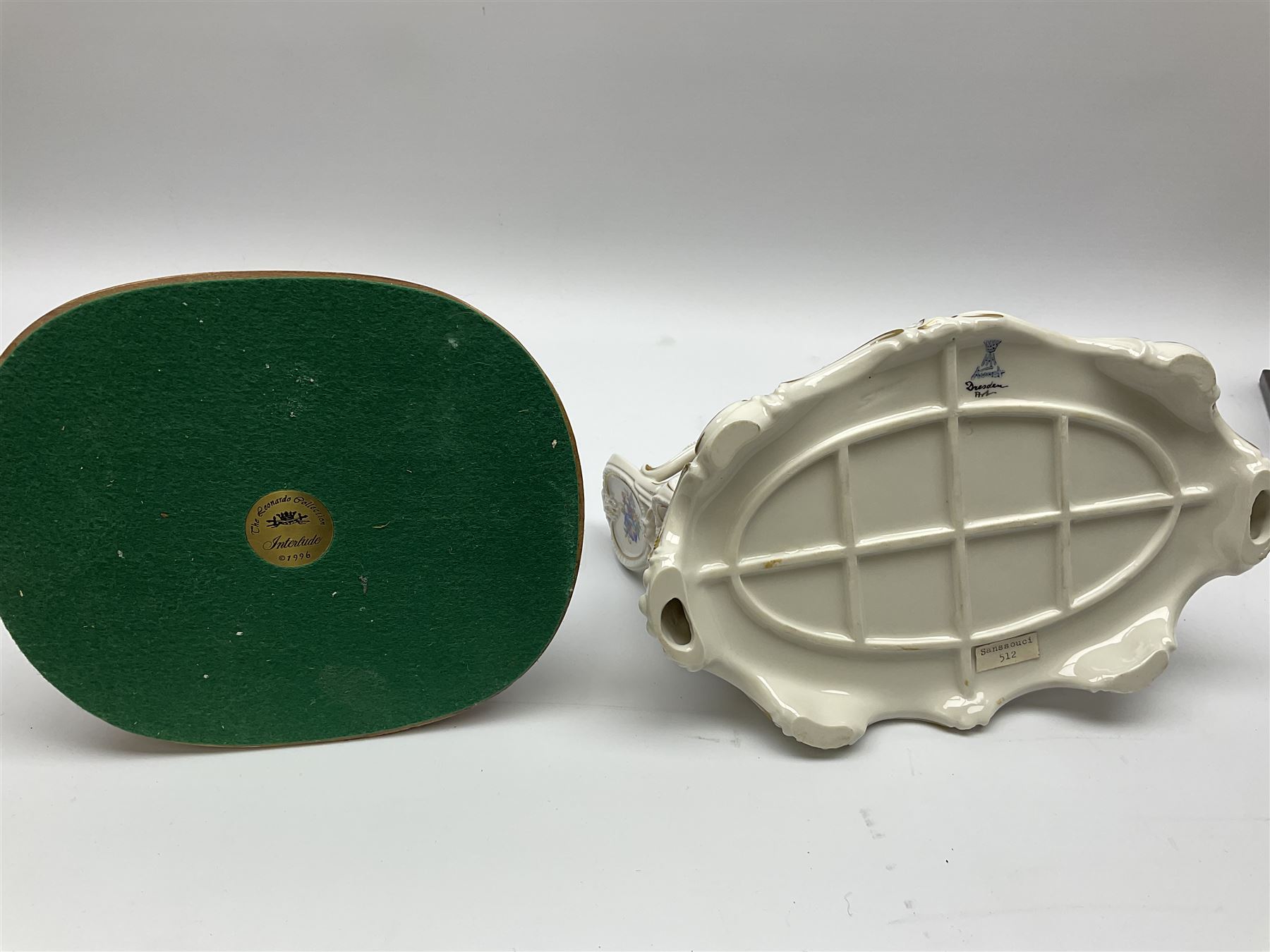 A small pair of Sitzendorf figures modelled as shepherd and shepherdess, H10.5cm together with a Dresden porcelain figure modelled as a female figure playing the piano, H17cm, a Naples figure with floral bouquet, H27.5cm,  a Naples figure holding a dog, H33cm, and a Leonardo Collection figure, Interlude, H24cm. 