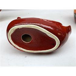 Collection of Poole Pottery, comprising charger and vase in Volcano pattern and a duck figure in a similar pattern 